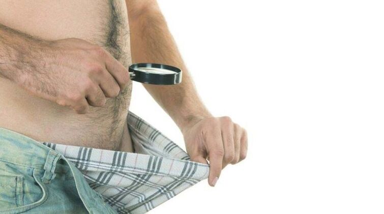 a man looks at his underwear and thinks about enlarging his penis with soda